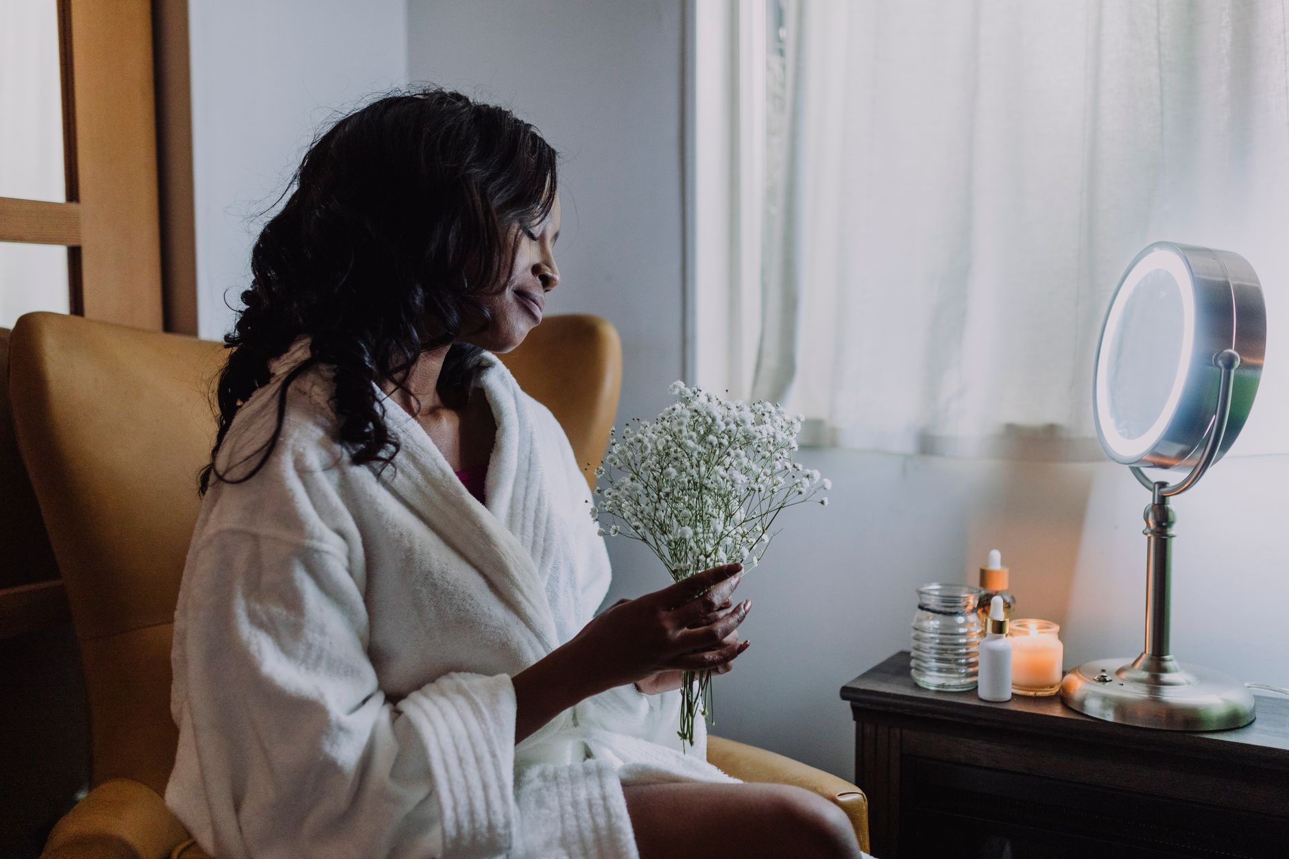 A guest in a robe unwinding before a treatment